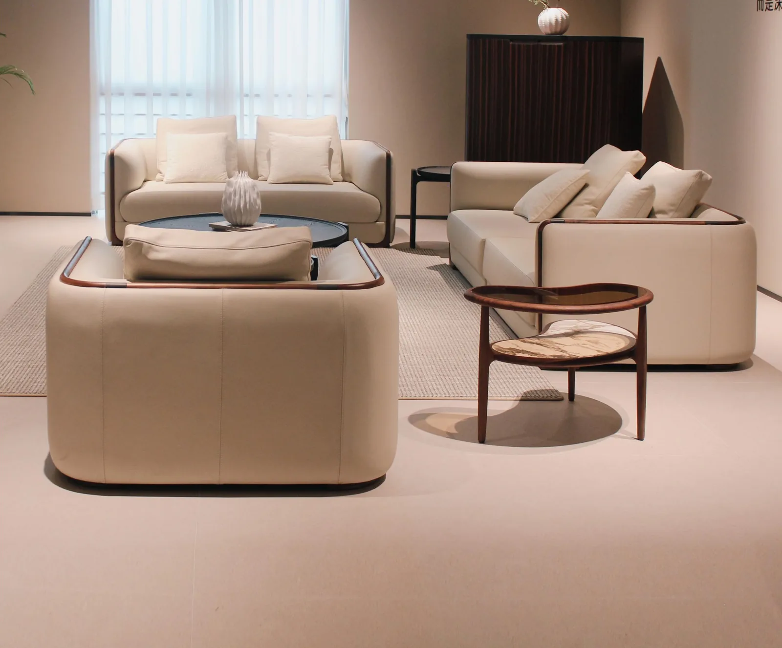 Junzi Collection living room with leather sofas and walnut side table