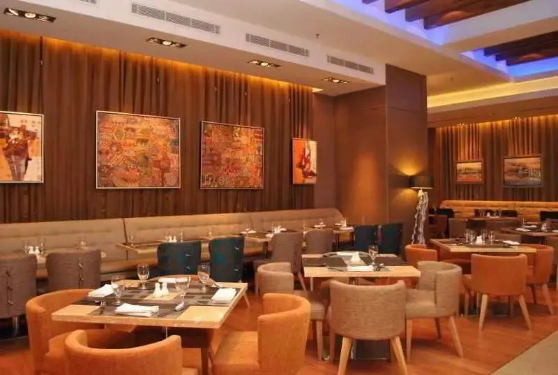 Hotel restaurant dining area with colourful wall art